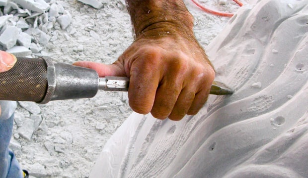 hands that carve marble
